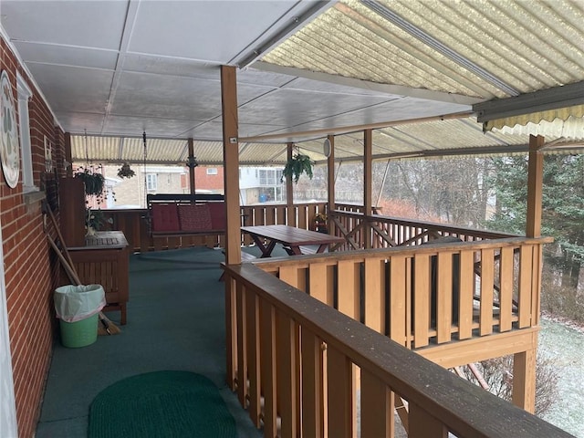 deck featuring a jacuzzi
