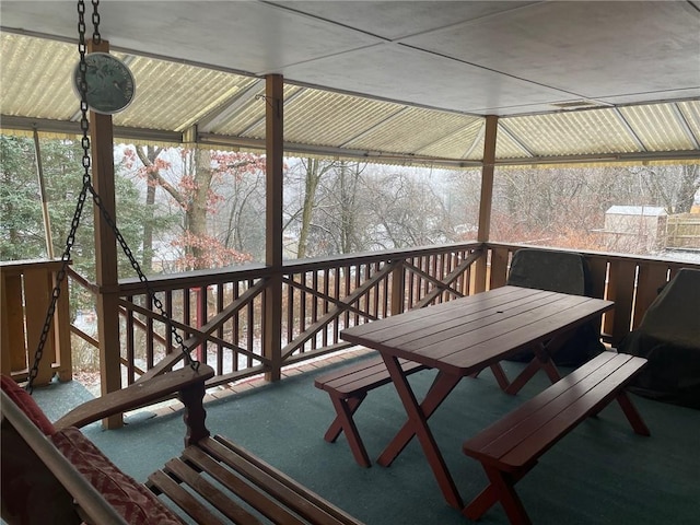 wooden terrace featuring outdoor dining space