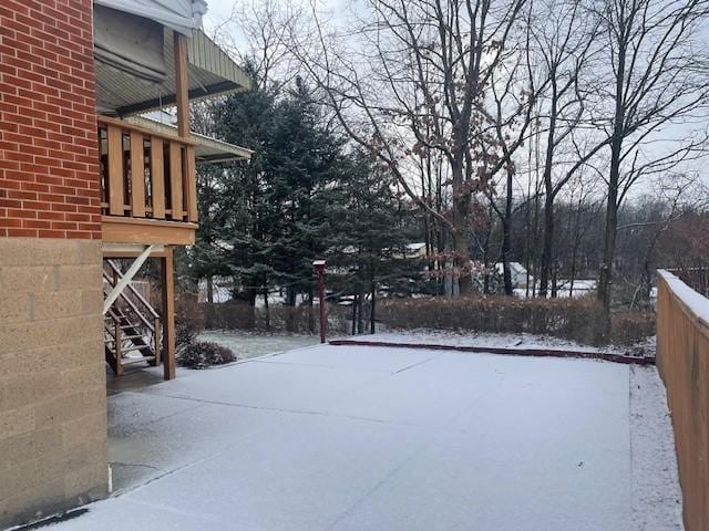 snowy yard with stairs