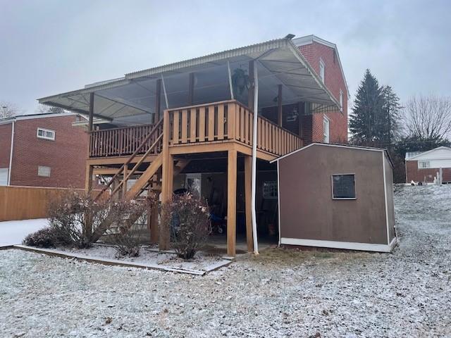 rear view of house featuring a deck