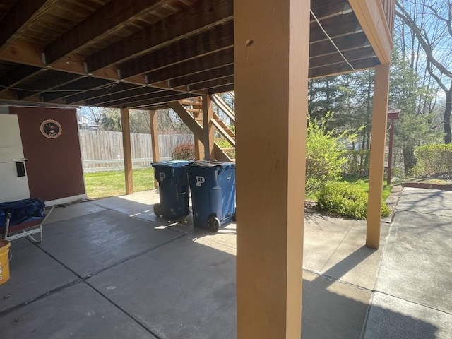 view of patio / terrace featuring fence