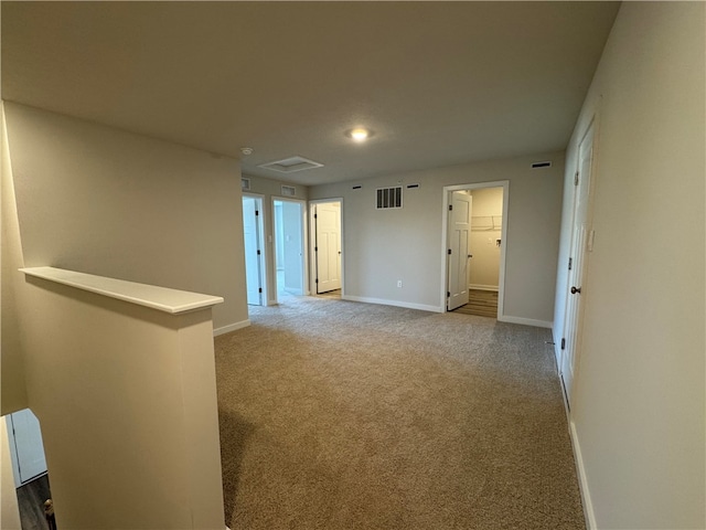 unfurnished room with light carpet