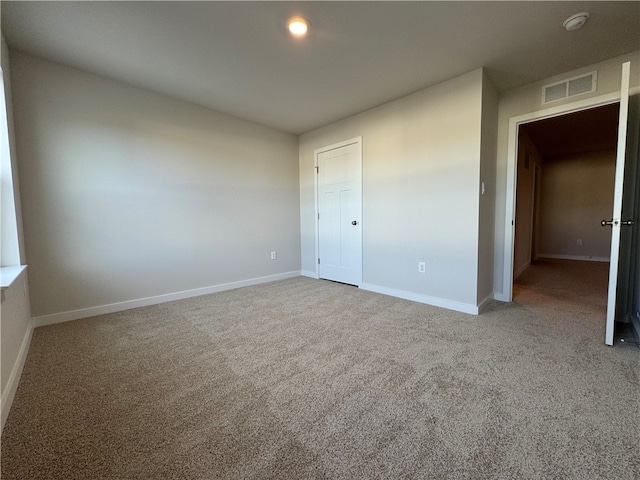 unfurnished bedroom with a closet and carpet