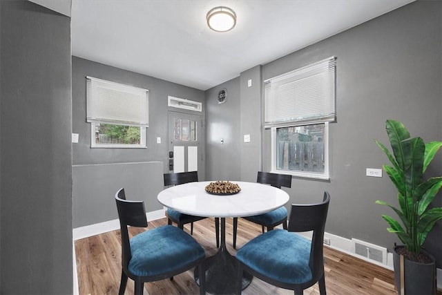 dining space featuring hardwood / wood-style flooring