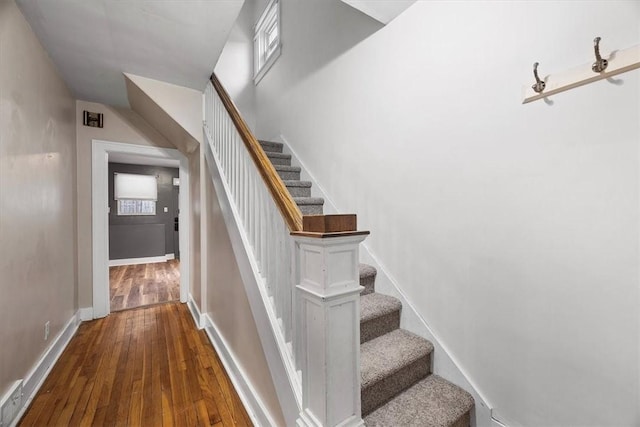 stairs with wood-type flooring