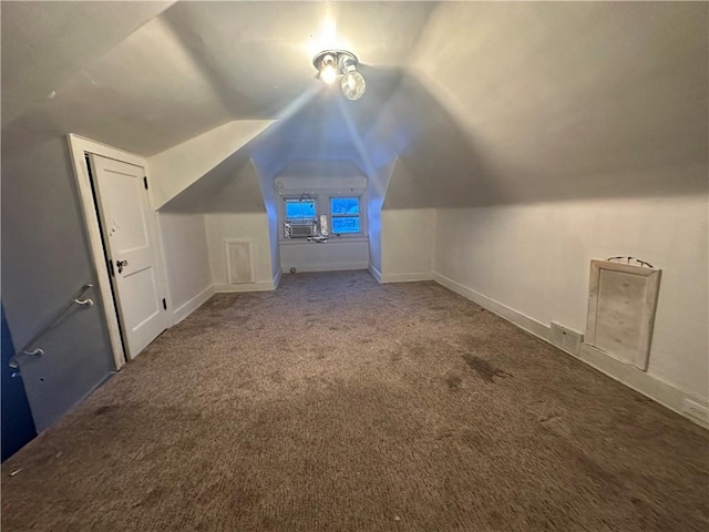 bonus room featuring carpet flooring and vaulted ceiling