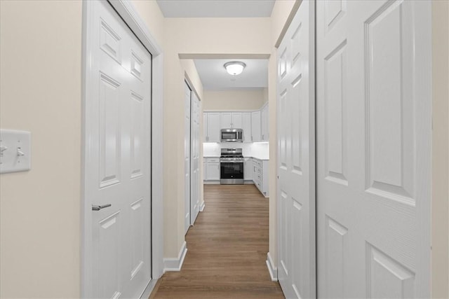 corridor featuring hardwood / wood-style flooring