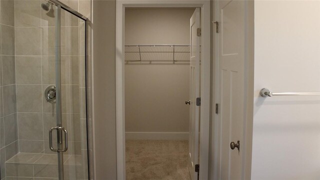 bathroom featuring an enclosed shower