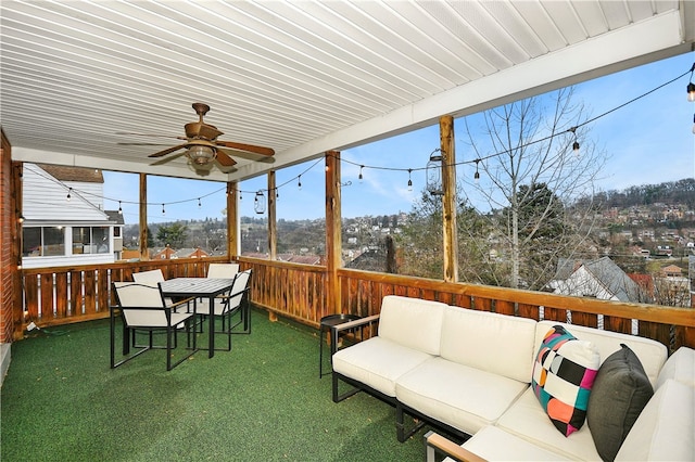 sunroom / solarium with ceiling fan