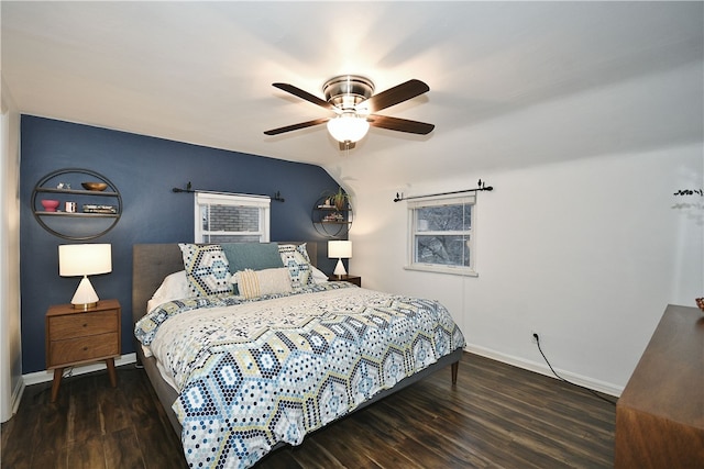 bedroom with ceiling fan and dark wood-type flooring