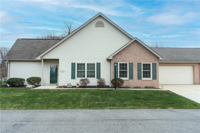 view of front facade with a garage and a front yard