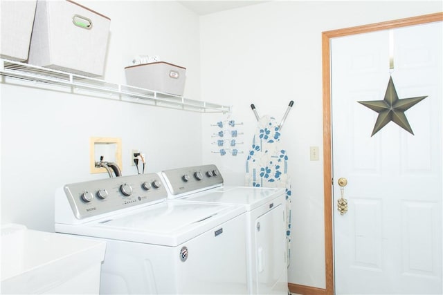 laundry area featuring sink and independent washer and dryer