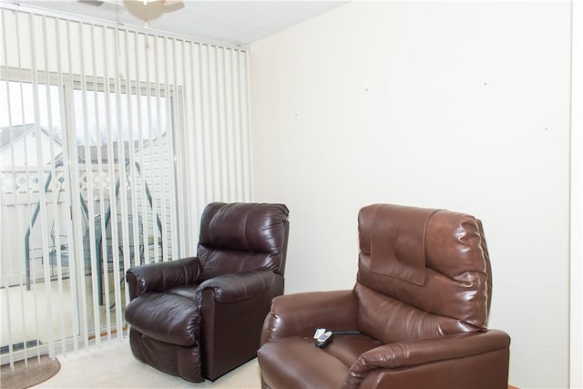 living area with light colored carpet