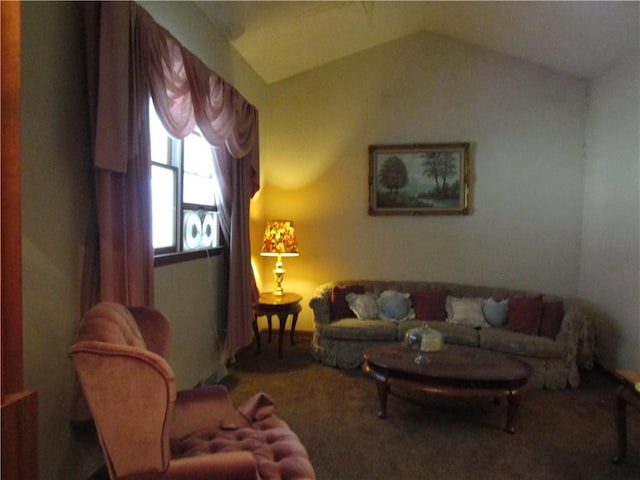 carpeted living room featuring vaulted ceiling