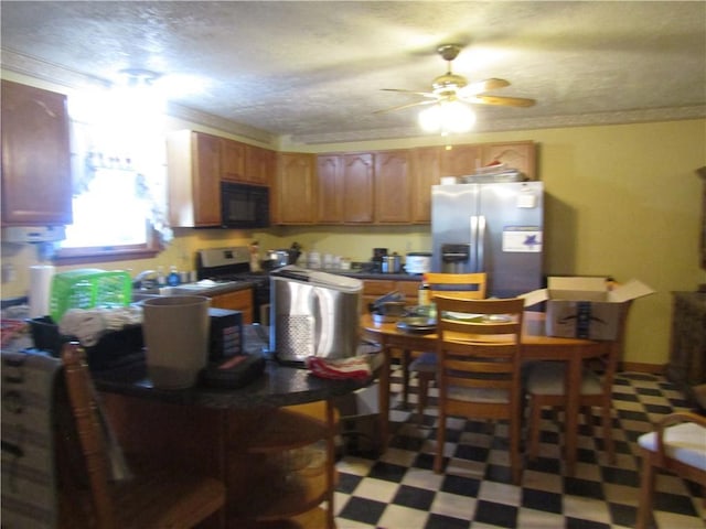 kitchen featuring stove, stainless steel refrigerator with ice dispenser, crown molding, ceiling fan, and a textured ceiling