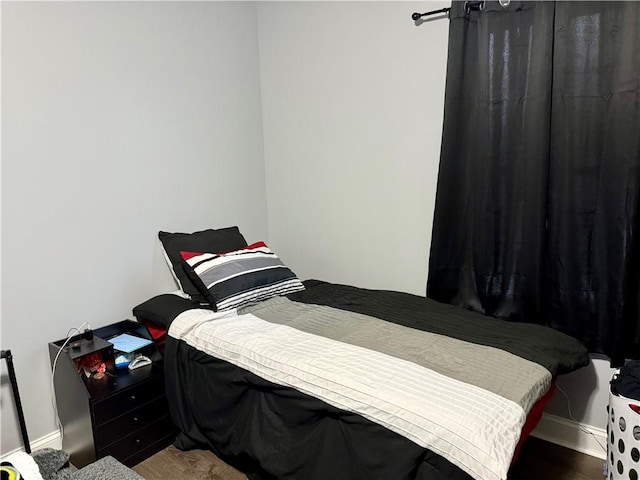 bedroom with hardwood / wood-style floors