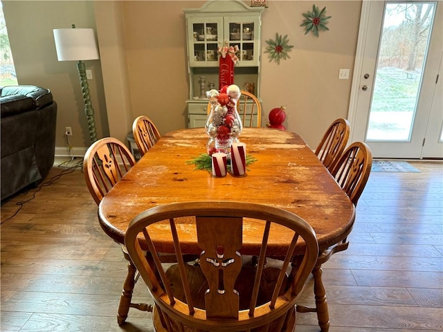 dining area with plenty of natural light and light hardwood / wood-style floors