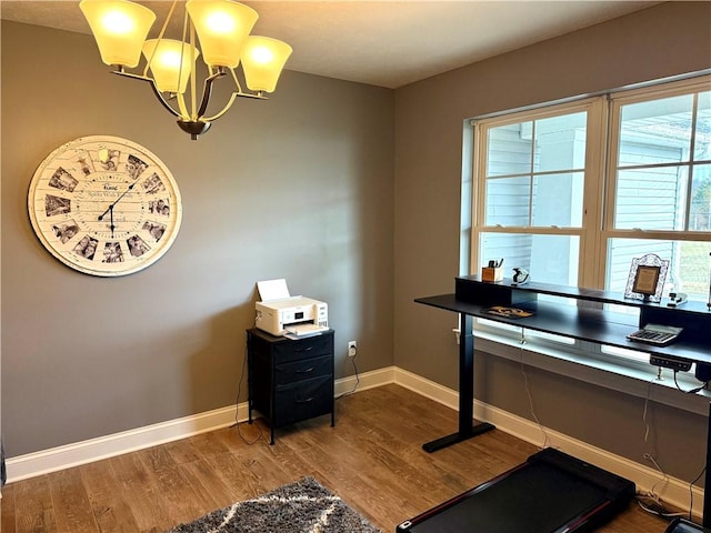 office featuring hardwood / wood-style floors and a chandelier