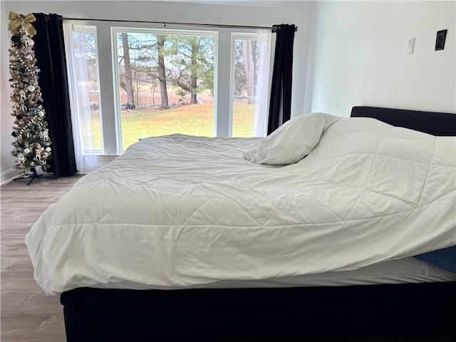 bedroom with light wood-type flooring