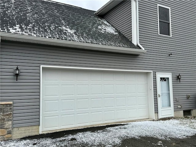 view of snow covered garage