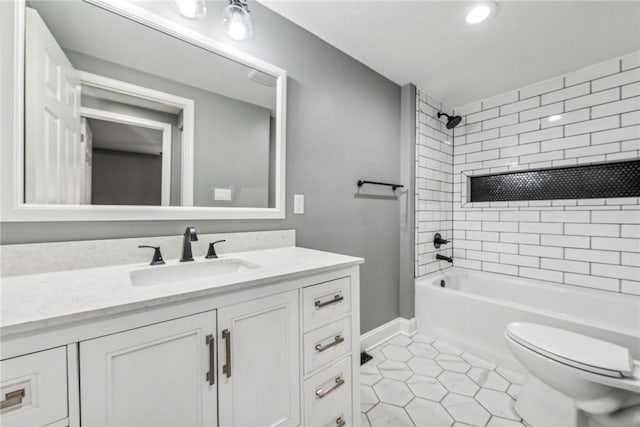 full bathroom with tile patterned flooring, toilet, vanity, and tiled shower / bath