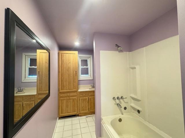 bathroom with tile patterned floors, vanity, and shower / bathing tub combination