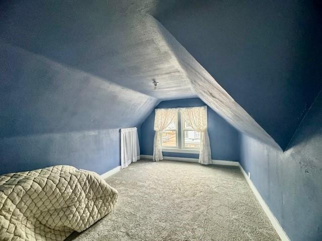 bonus room featuring carpet and lofted ceiling