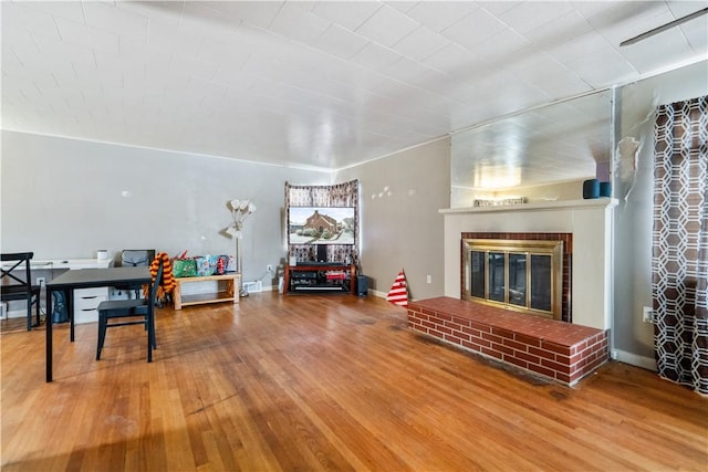 living room featuring a fireplace and hardwood / wood-style floors