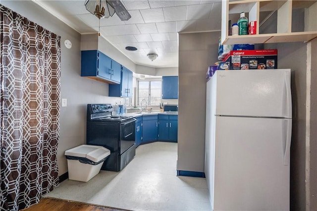 kitchen featuring white refrigerator, sink, blue cabinetry, and black electric range