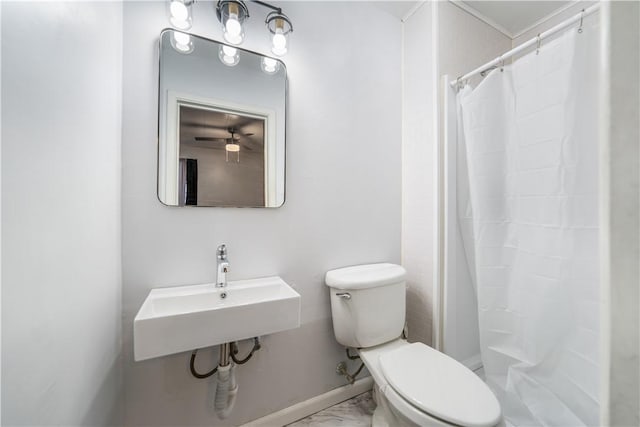 bathroom featuring a shower with curtain and toilet