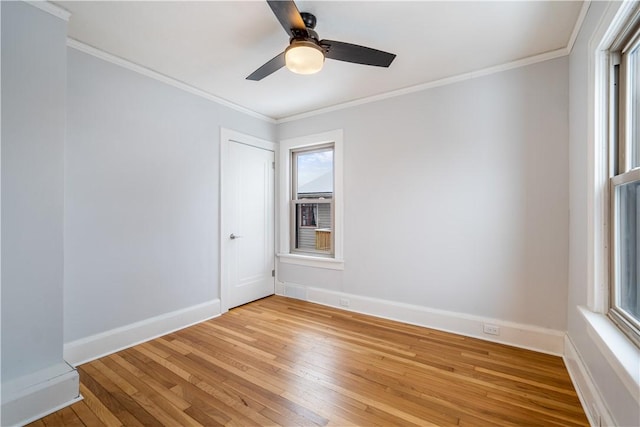 unfurnished room featuring crown molding, hardwood / wood-style floors, and ceiling fan