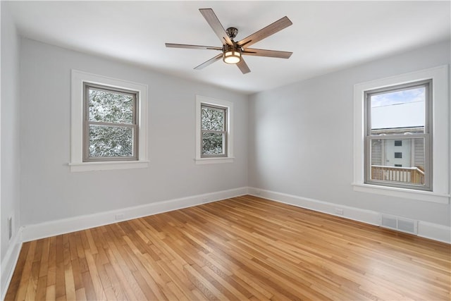 spare room featuring ceiling fan and light hardwood / wood-style flooring