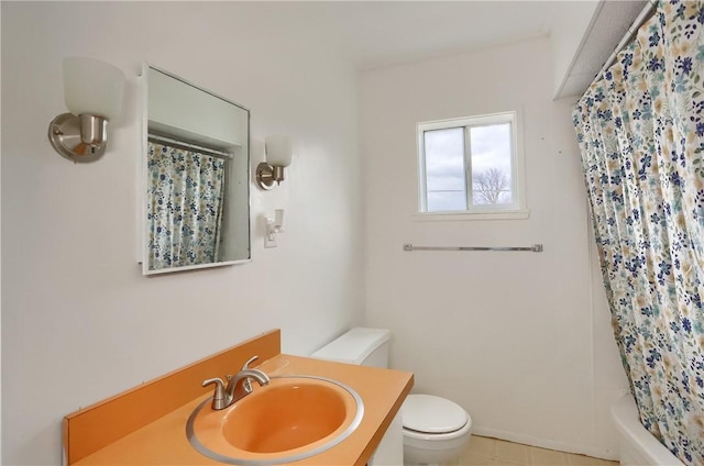 full bathroom featuring tile patterned floors, shower / tub combo with curtain, vanity, and toilet