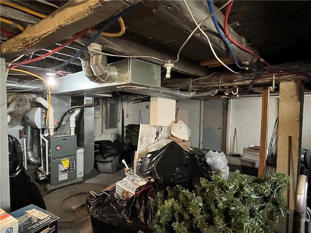 interior space featuring electric panel and heating unit