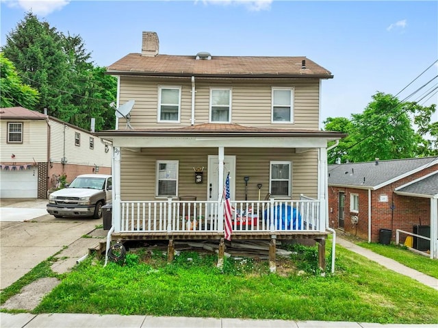 view of front of property featuring covered porch