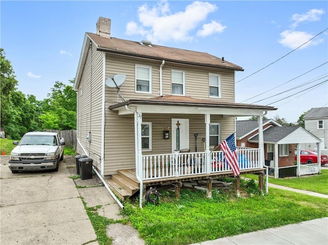 view of front of property featuring covered porch