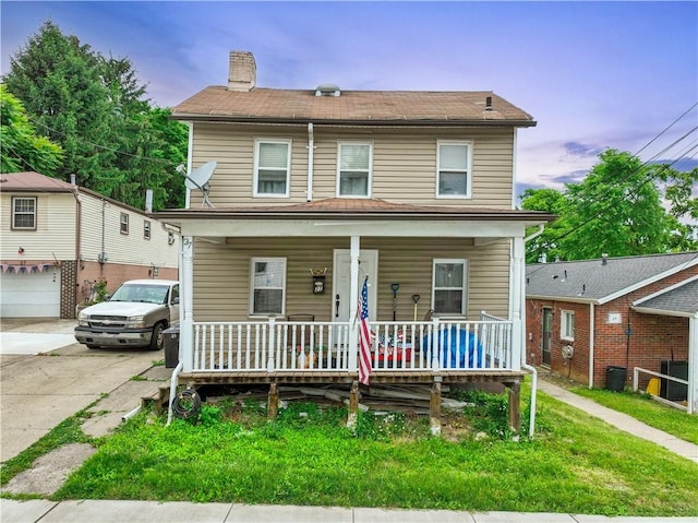 view of front of property with a porch and central AC unit