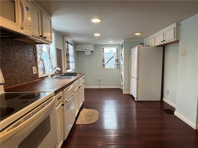 kitchen with backsplash, dark hardwood / wood-style flooring, white appliances, and wood counters