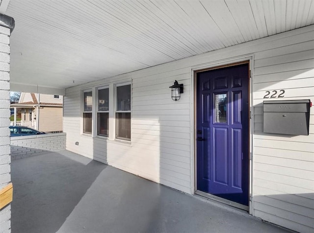 doorway to property with a porch