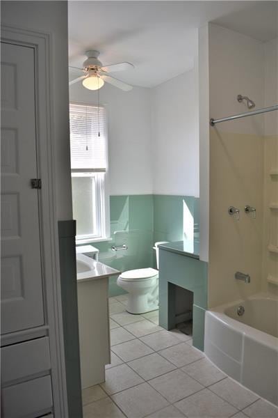 full bathroom featuring ceiling fan, tile patterned floors, shower / bath combination, toilet, and vanity