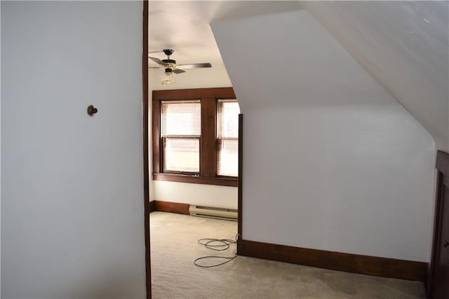 bonus room featuring light carpet, a baseboard heating unit, ceiling fan, and lofted ceiling