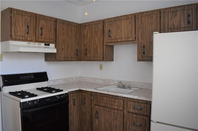 kitchen with sink and white appliances