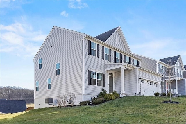 view of side of home with central AC, a yard, and a garage