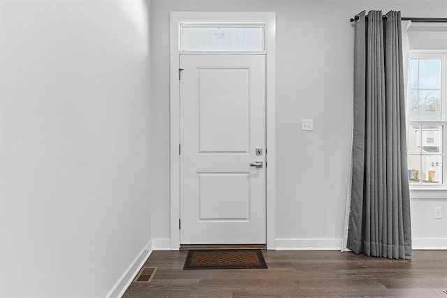 doorway featuring dark wood-type flooring