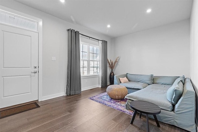 living room featuring dark wood-type flooring