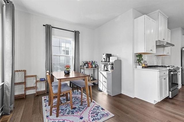 dining area featuring dark wood-type flooring