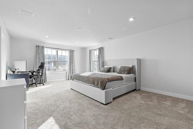 bedroom with light carpet