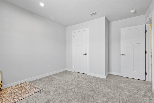 interior space featuring light colored carpet