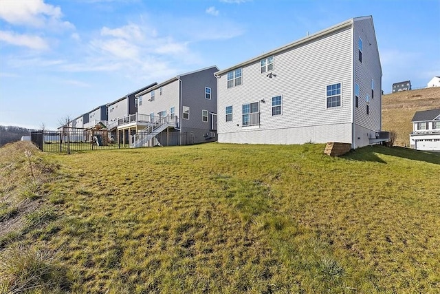 rear view of house with a yard