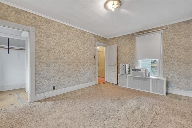 unfurnished bedroom with crown molding, a closet, and carpet floors